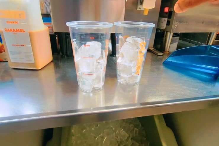 Filling your glass with ice cubes