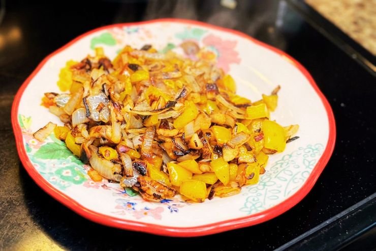 Cook the peppers and onions