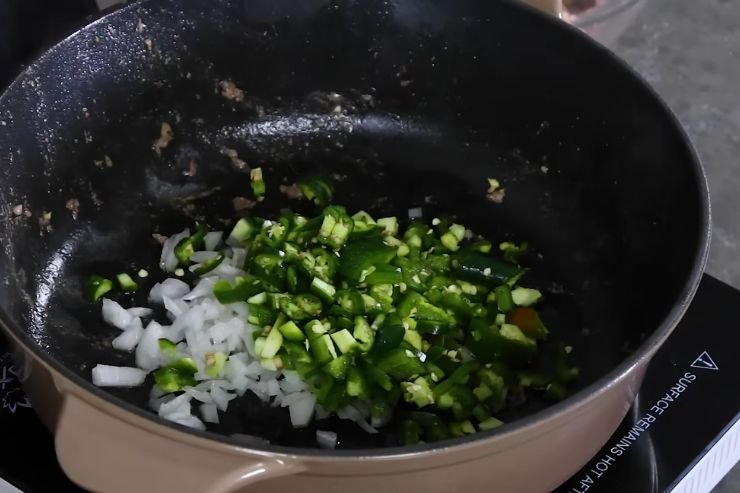 Cook the Onion and Peppers